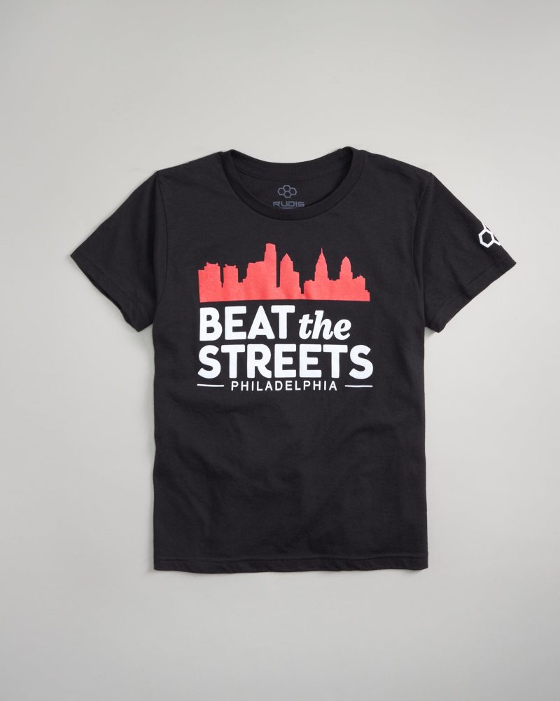 A black t-shirt featuring a graphic of the Philadelphia skyline with the text BEAT the STREETS prominently displayed in white and red