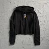 A stylish black cropped hoodie featuring a colorful graphic design on the chest against a textured white background