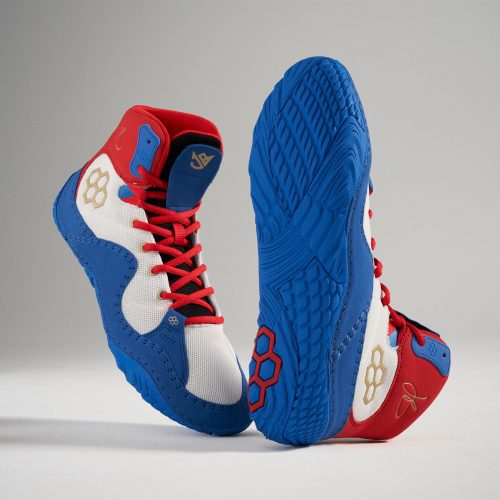 A vibrant pair of athletic shoes featuring a blue white and red color scheme designed for both performance and style with distinct detailing throughout