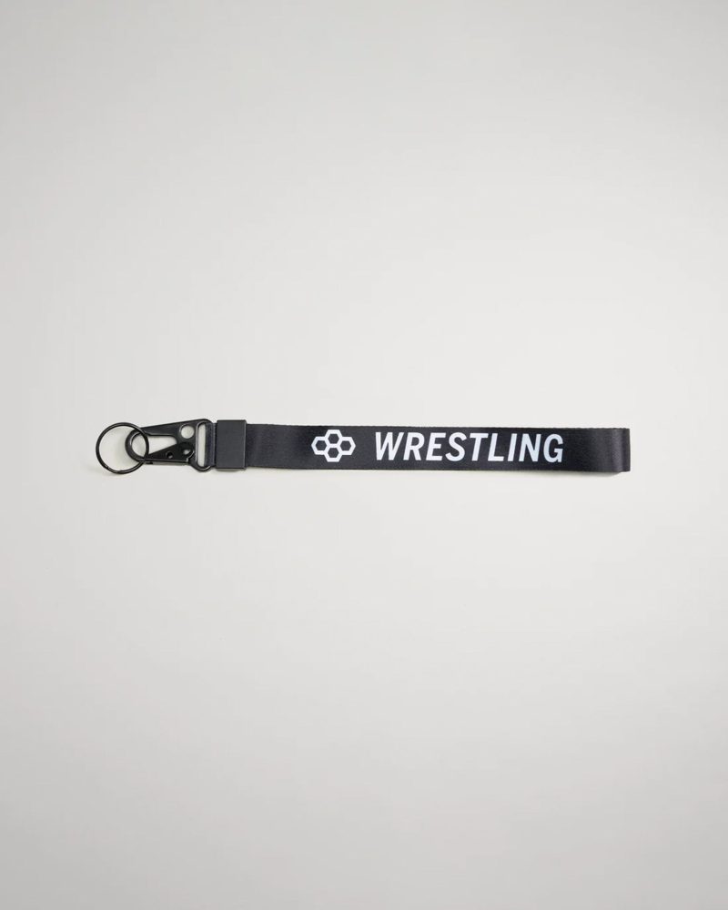 A black lanyard with the word WRESTLING printed in white featuring a clip and keyring attachment