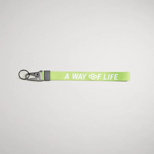 A vibrant green lanyard featuring the phrase A WAY OF LIFE in bold white letters equipped with a metal clip and keyring for secure attachment