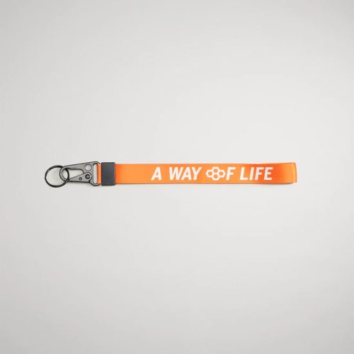 An orange lanyard featuring the phrase A WAY OF LIFE in white lettering with a metal clip and keyring attachment for versatility