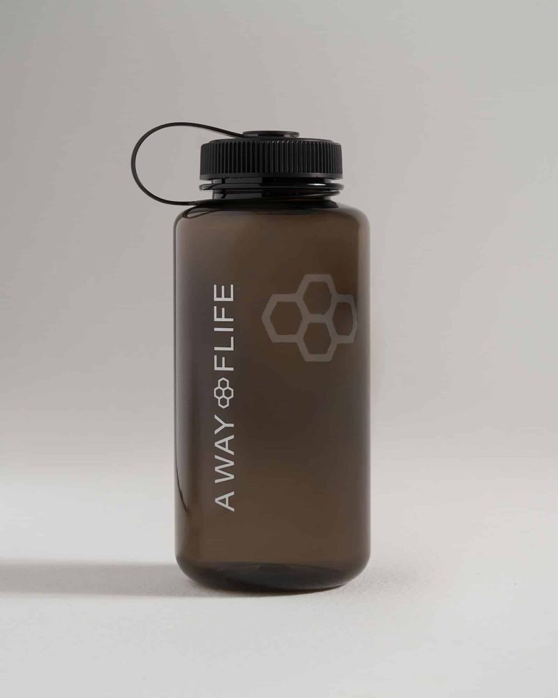 A sleek dark gray water bottle with bold white lettering and a honeycomb design on the side featuring a secure twist cap and a loop for easy carrying